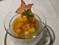 mango ice cream on fruit salad